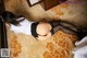 A woman laying on the floor in a hotel room.